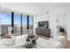 Bright living room with floor-to-ceiling windows offering beautiful water views at 2912 Santiago St # 1201, Tampa, FL 33629