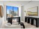Office space with modern desk, décor, and a wall of windows with city views at 2912 Santiago St # 1201, Tampa, FL 33629
