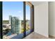 A stunning view showcasing a city skyline and the bay, captured through a large, picturesque window at 2912 Santiago St # 1201, Tampa, FL 33629