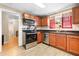 Well-equipped kitchen with stainless steel appliances and granite countertops at 8145 Fox Hollow Dr, Port Richey, FL 34668