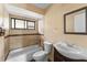Bathroom with tub, toilet and vanity at 15635 Bear Creek Dr, Tampa, FL 33624