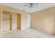 Bedroom with tile floors and ceiling fan at 15635 Bear Creek Dr, Tampa, FL 33624