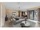 Living room with light flooring and access to the backyard at 15635 Bear Creek Dr, Tampa, FL 33624