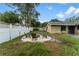 Fire pit area in the backyard with chairs at 15635 Bear Creek Dr, Tampa, FL 33624