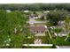 Aerial view showcasing the home's backyard and firepit area at 15635 Bear Creek Dr, Tampa, FL 33624