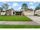 House exterior with lawn and driveway at 15635 Bear Creek Dr, Tampa, FL 33624