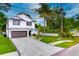 Two-story home with modern design and paver driveway at 1105 Conant Ave, Safety Harbor, FL 34695