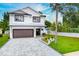 Two-story home with modern design and paver driveway at 1105 Conant Ave, Safety Harbor, FL 34695