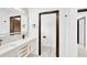 Bright bathroom with double vanity and a view into another room at 1105 Conant Ave, Safety Harbor, FL 34695