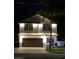 Two-story house with a well-lit exterior at night at 1105 Conant Ave, Safety Harbor, FL 34695