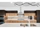 Modern kitchen with marble countertops and stainless steel appliances at 1105 Conant Ave, Safety Harbor, FL 34695