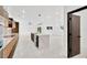 Modern kitchen with light marble countertops and island at 1105 Conant Ave, Safety Harbor, FL 34695