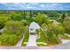 Two-story home nestled amongst lush green trees at 1105 Conant Ave, Safety Harbor, FL 34695
