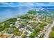 Aerial view showcasing waterfront homes and lush greenery at 1105 Conant Ave, Safety Harbor, FL 34695