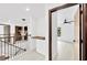 Upstairs hallway with built-in cabinetry and modern chandelier at 1105 Conant Ave, Safety Harbor, FL 34695