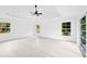 Spacious bedroom with light wood flooring, high ceilings, and sliding glass doors at 1105 Conant Ave, Safety Harbor, FL 34695
