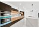 Modern kitchen with dark cabinetry and marble backsplash at 1105 Conant Ave, Safety Harbor, FL 34695