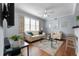 Bright living room with hardwood floors, comfy seating, and large windows at 501 Knights Run Ave # 2120, Tampa, FL 33602