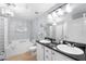 Bathroom boasts a large soaking tub and double vanity at 501 Knights Run Ave # 2120, Tampa, FL 33602