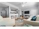 Open concept living room with a breakfast bar and comfortable seating at 501 Knights Run Ave # 2120, Tampa, FL 33602