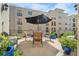 Outdoor patio with table and chairs, perfect for dining al fresco at 501 Knights Run Ave # 2120, Tampa, FL 33602