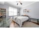 Bright bedroom with hardwood floors and built-in shelves at 501 Knights Run Ave # 2120, Tampa, FL 33602