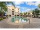Inviting community pool with surrounding lounge chairs at 501 Knights Run Ave # 2120, Tampa, FL 33602
