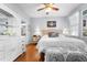 Spacious bedroom with hardwood floors and a comfy bed at 501 Knights Run Ave # 2120, Tampa, FL 33602