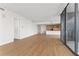 Open living room showcasing hardwood floors and modern kitchen at 2912 Santiago St # 1201, Tampa, FL 33629