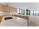 Modern kitchen with marble countertops and gold hardware, offering water views at 2912 Santiago St # 1201, Tampa, FL 33629