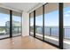 Bright living room with hardwood floors and balcony access at 2912 Santiago St # 1201, Tampa, FL 33629