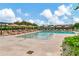 Expansive pool area with lounge chairs and umbrellas at 2912 Santiago St # 1201, Tampa, FL 33629