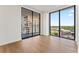 Luxury bedroom with floor-to-ceiling windows and city views at 2912 Santiago St # 1201, Tampa, FL 33629
