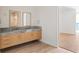 Bathroom with double vanity and view to bedroom at 2912 Santiago St # 1201, Tampa, FL 33629