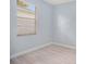 Bright bedroom with light blue walls and wood-look floors at 1839 Sunrise Dunes Ct, Tarpon Springs, FL 34689