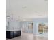 Modern kitchen with an island, white cabinets and stainless steel appliances at 1839 Sunrise Dunes Ct, Tarpon Springs, FL 34689