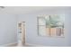 Bedroom with light blue walls, window with blinds, and wood-look floors at 1839 Sunrise Dunes Ct, Tarpon Springs, FL 34689