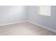 Light, spacious bedroom with wood-look floors and a window at 1839 Sunrise Dunes Ct, Tarpon Springs, FL 34689