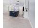Modern kitchen with a large island, dark blue cabinets, and white countertops at 1839 Sunrise Dunes Ct, Tarpon Springs, FL 34689