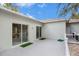 Spacious back patio with sliding glass doors and a fenced yard at 1839 Sunrise Dunes Ct, Tarpon Springs, FL 34689