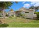 Front view of one-story house with attached garage at 1839 Sunrise Dunes Ct, Tarpon Springs, FL 34689