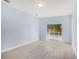 Light and bright bedroom with sliding glass doors leading to the backyard at 1839 Sunrise Dunes Ct, Tarpon Springs, FL 34689