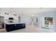 Modern kitchen with white cabinets, large island, and stainless steel appliances at 1839 Sunrise Dunes Ct, Tarpon Springs, FL 34689