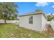 Single-story house exterior with a large yard at 1839 Sunrise Dunes Ct, Tarpon Springs, FL 34689