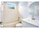 Clean bathroom with white vanity and beige bathtub at 1839 Sunrise Dunes Ct, Tarpon Springs, FL 34689