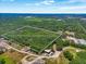 Aerial view displaying approximate property lines, surrounded by dense tree coverage and nearby development at 0 Castlewood Rd # Lot 3, Seffner, FL 33584