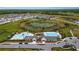 Community overview featuring a resort-style pool, playground, and pond at 13029 Paddock Wood Pl, Riverview, FL 33579