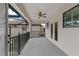Private balcony with a ceiling fan and screened enclosure offering outdoor enjoyment at 13029 Paddock Wood Pl, Riverview, FL 33579
