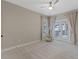 Spacious bedroom with plush carpeting, ceiling fan and access to a private balcony at 13029 Paddock Wood Pl, Riverview, FL 33579