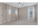 Bright bedroom with neutral walls, carpet, and plenty of natural light at 13029 Paddock Wood Pl, Riverview, FL 33579